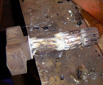 Cast steel shaft built up with weld prior to machining