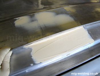 Applying body filler using a steel rule