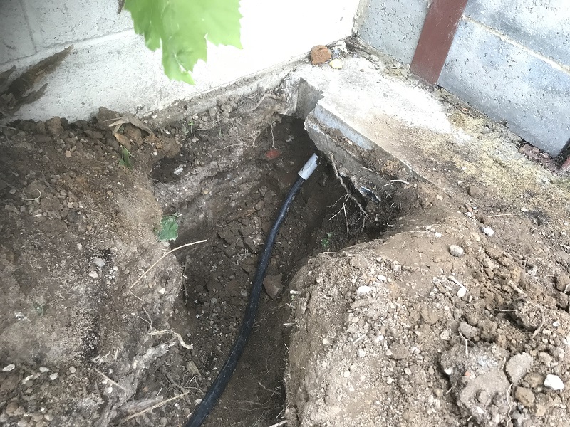 Cable-Sleeved-Through-Concrete-Hole.jpg