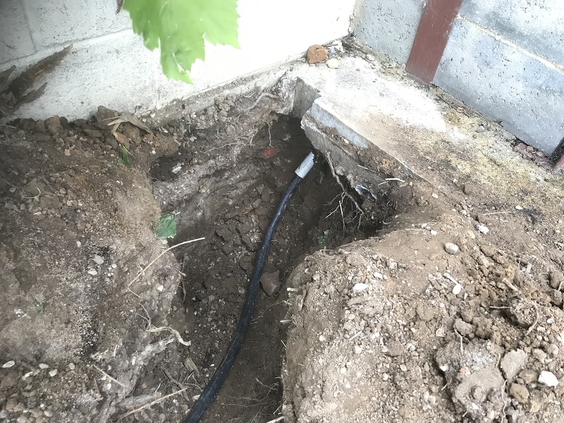 Cable-Sleeved-Through-Concrete-Hole.jpg