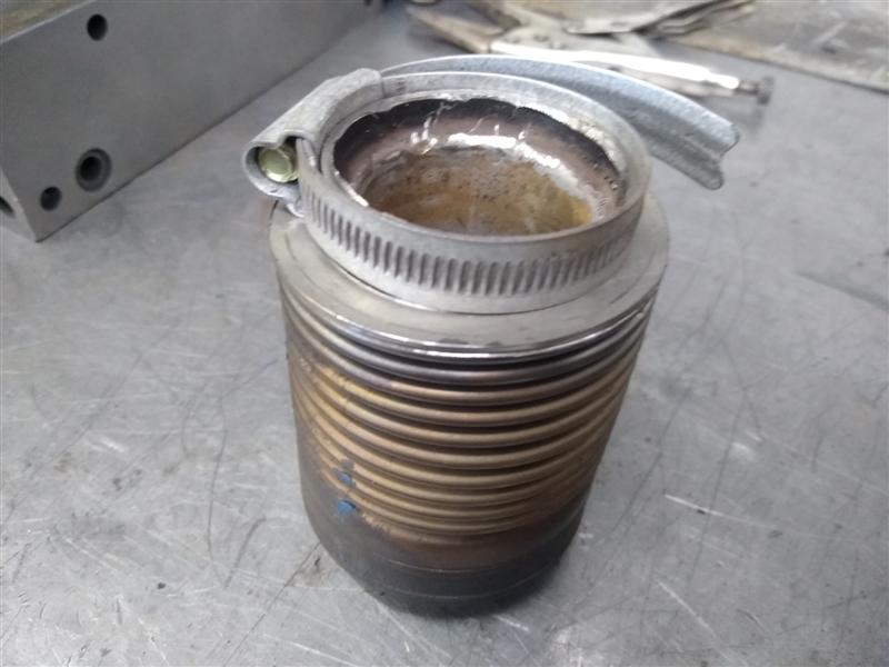 Welding up rotted exhaust flexijoint bellows. MIG Welding Forum