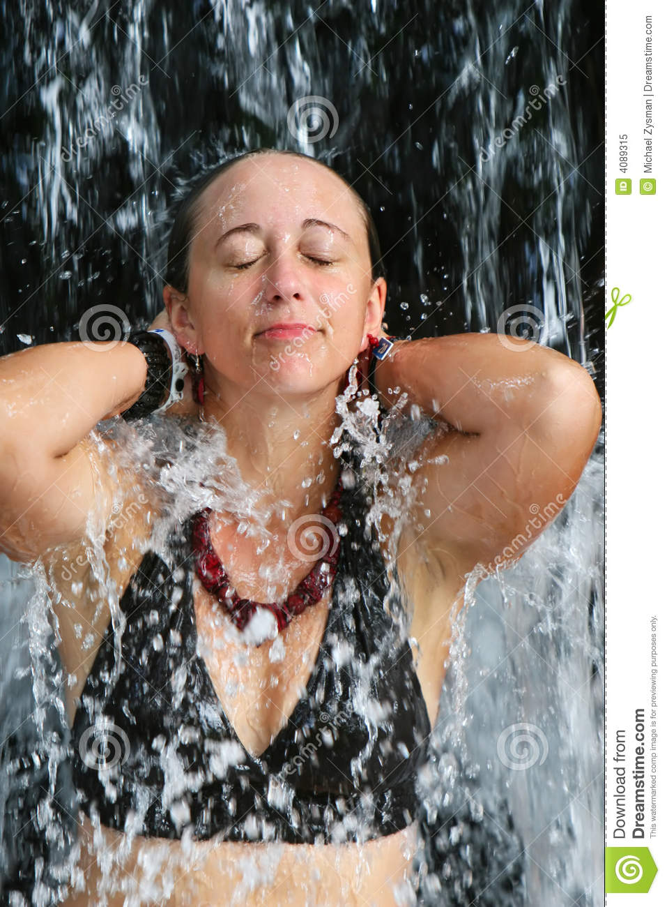 girl-under-relaxing-waterfall-4089315.jpg