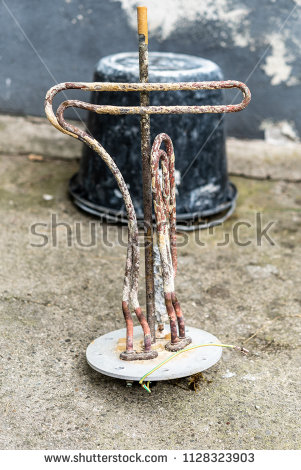 stock-photo-heating-element-of-water-heater-with-a-lot-of-chalk-and-damaged-1128323903.jpg