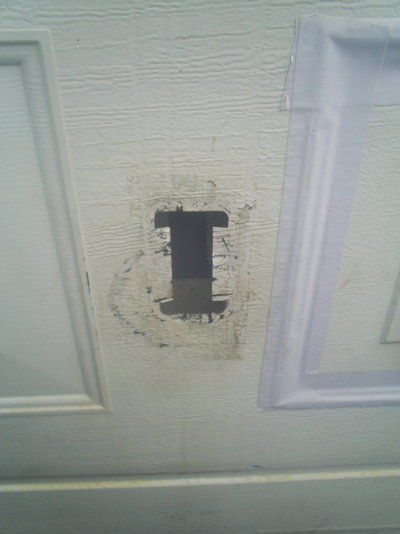 Garage door  old handle hole.JPG
