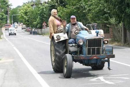 A tractor missing a front wheel.jpg