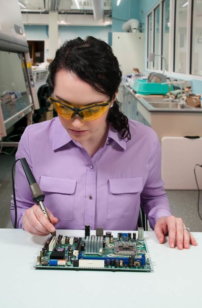 holding soldering iron.jpg