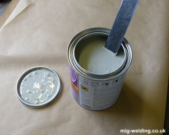 Stirring paint with a steel rule