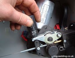 Installing and tensioning MIG wire